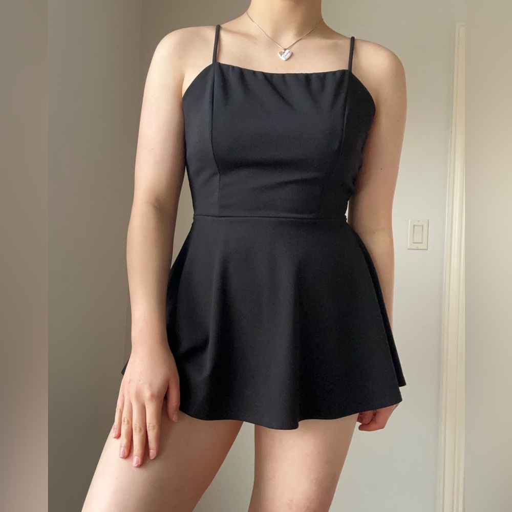 Black mini romper with adjustable straps and bow tie back #romper #cute